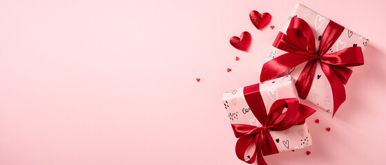 Wrapped gifts with red bows, and scattered paper hearts on pastel pink background. Happy Valentine's Day banner template.