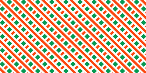 Christmas seamless pattern. Red and green diagonal stripes background. Candy cane repeating decoration wallpaper. Winter holiday lines backdrop. Xmas peppermint present wrapping print design. Vector