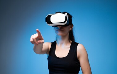 Woman using virtual reality headset and interacting with digital interface in immersive VR environment