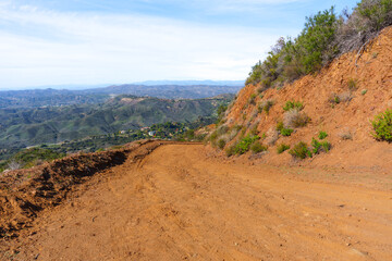 Scenic Dirt Road Winding Through Arid Hills Of Santa Monica Mountains