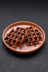 Belgian waffles, a healthy sweet breakfast dessert, food background. Belgian waffles
