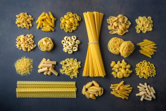 Composition with different tasty uncooked pasta - Italian pasta wallpaper, different types and shapes of pasta layout - Powered by Adobe