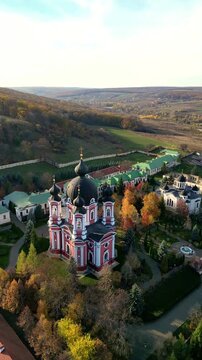 vertical Curchi Monastery aerial view in Moldova during autumn