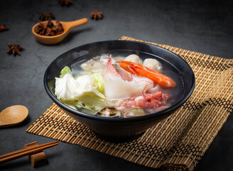 Seafood congee hot pot, Steaming with shrimp, fish, clams, and vegetables, it's a healthy, delicious culinary experience