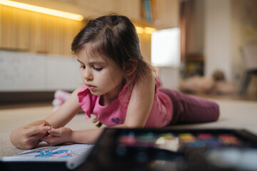 Fototapeta premium Girl Creating Art With Watercolors, Young Female Artist Engrossed In Watercolor Artwork At Home