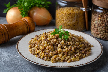 Traditional delicious Turkish foods; bulgur pilaf with green lentils (Turkish name; yesil mercimekli bulgur pilavi)
