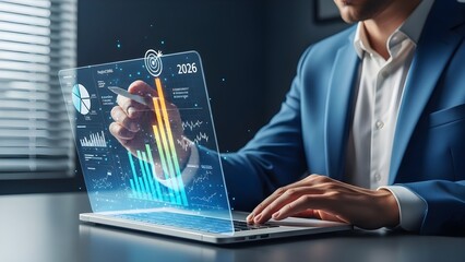 Businessman analyzing complex financial data on a futuristic laptop with a transparent holographic display.