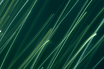 diagonal light lines, dark green background