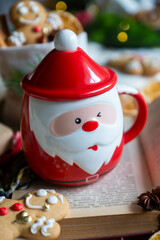 On the table there is New Year's tea 2026, coffee, gingerbread and pine cone cookies.
