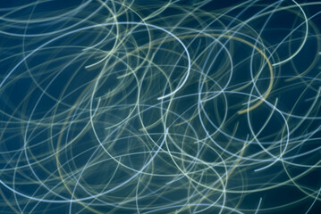 Abstract, turquoise and cream-colored wavy line background