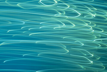 Abstract background with a vibrant, ocean wave pattern in aqua blue