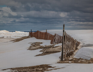 wooden fence on the beach