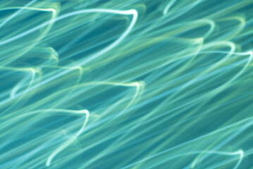 Diagonal abstract lights on a light blue background. Motion blur.