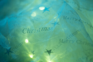 Silver background made of sequins and lights. Festive theme.