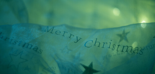 Merry Christmas lettering on thin fabric