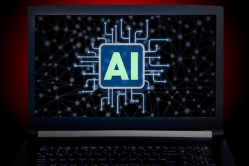 Modern technology concept image of a laptop computer with a glowing AI chip icon on the screen, surrounded by digital circuit lines and a dark neural network background.