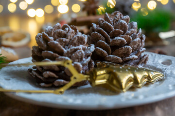 On the table there is New Year's tea 2026, coffee, gingerbread and pine cone cookies.