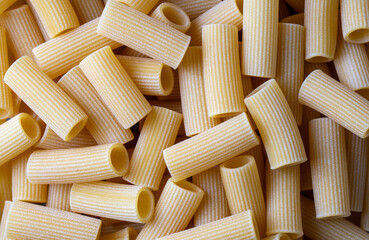 Close up of rustic uncooked italian rigatoni pasta