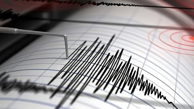 Close-up of a seismograph recording an earthquake with red concentric circles