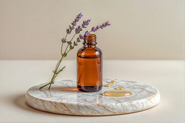 Lavender oil in a glass bottle on a marble surface with drops of oil and lavender sprigs during natural light