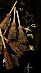 Witch brooms and magical symbols on black background occult charms, moon, stars and pentagram for mystical rituals and witchcraft