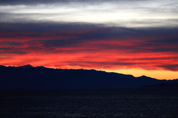 Colorful sunset or sunrise sky over the sea.