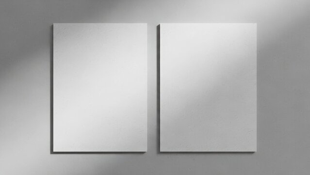 Two blank white papers casting shadows on a textured gray wall, evoking a minimalist aesthetic