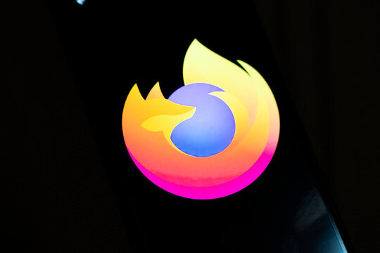 Warsaw, Poland - Dec 4, 2025: Close-up of a phone screen displaying the Firefox logo with vibrant colors. This illustration showcases modern technology and internet browsing applications.