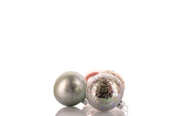 Glass Christmas balls isolated on white background, close-up.