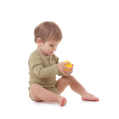 Cute little boy with ball sitting on white background