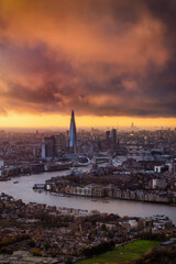 Moody sunset view with clouds and sunlight of the London cityscape, England