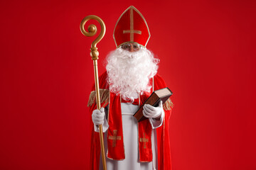 Saint Nicholas with book and crozier on red background