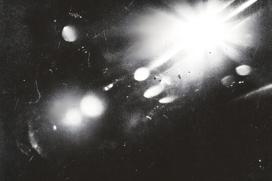 retro film overlay effect with scratch dust and ligh leaks,retro grain noisy flm distressed texture ligh leak flare on black backgound,Black and white backgound