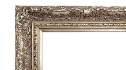 Obraz premium Ornate Corner of Antique Silver Picture Frame with Carved Details and Decorative Molding on White Background