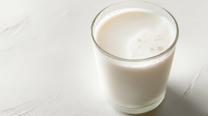 Glass of Fresh Milk on White Surface: Nutritious Dairy Beverage for Healthy Lifestyle