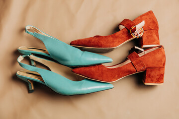 Vintage shoes in teal and red on a neutral background
