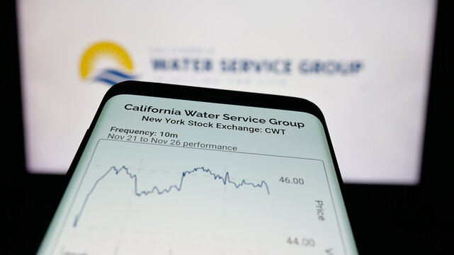 Stuttgart, Germany - 11-27-2025: Mobile phone with website of US company California Water Service Group on screen in front of logo. Focus on top-left of phone display.