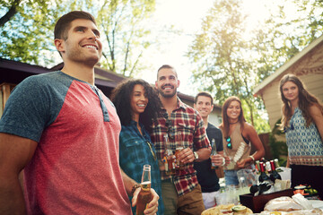 Drinks, barbecue and group of friends in backyard with food at event for bonding together. Happy, alcohol beverage and people at bbq with reunion with meal, dinner or supper outdoor of apartment.