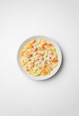 Pasta in a creamy sauce with shrimp and cheese. Italian cuisine.