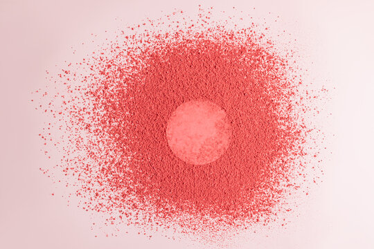 Blush powder explosion creating vibrant pink texture