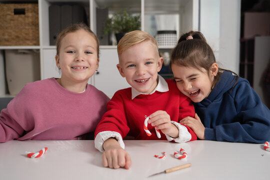 Children creating festive plasticine decorations