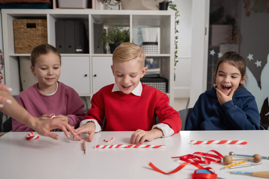 Children enjoying creative Christmas activities together