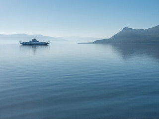 Passenger ferry in the calm Aegean Sea in Greece in a minimalist style