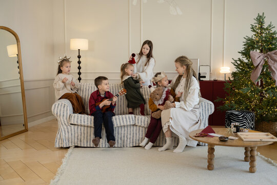Family enjoying Christmas together in festive living room