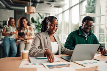 Diverse business team collaborating in modern office setting