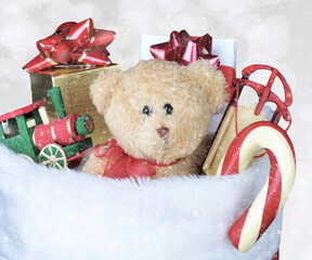 Christmas Stocking filled with toys - Bokeh Background with snow effect.