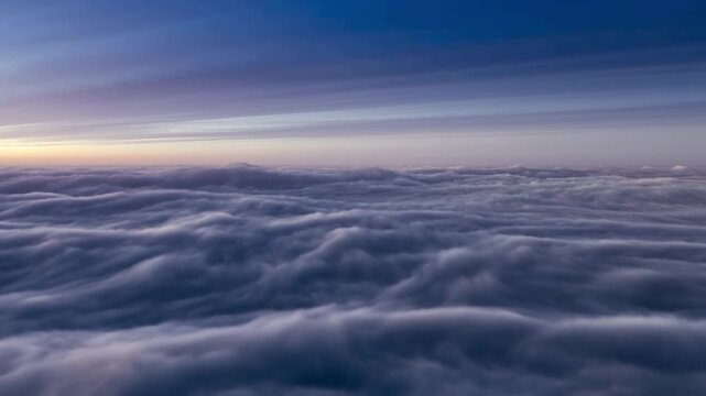 The majestic view of a sea of clouds as the day breaks with the beautiful color gradient. The atmosphere creates a serene and tranquil feeling Stock Video