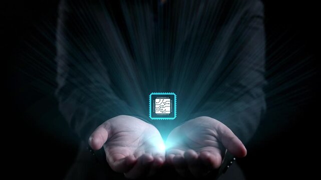 A close-up view of hands holding a glowing microchip surrounded by digital circuitry, symbolizing the fusion of technology and human capability for a bright future. Qubit