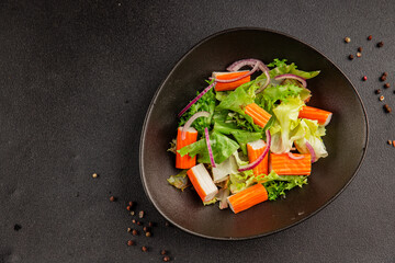 Crab sticks salad green salad leaves healthy food appetizer fresh gourmet food table setting rustic food top view copy space keto and paleo diet