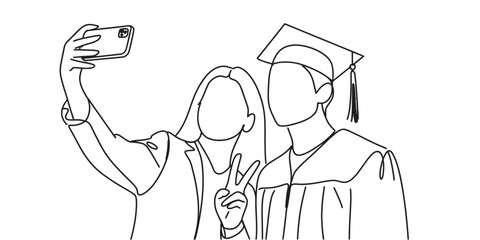 Two graduates in caps and gowns take a joyful selfie to celebrate their academic achievement.